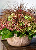 CHATEAU DE CHENONCEAU, FRANCE: A FLORAL DISPLAY BY FLORIST DAVID HOGUET WITH HYDRANGEAS AND GRASSES FROM THE CUTTING GARDEN IN THE BOUQUET FACTORY AT CHENONCEAU
